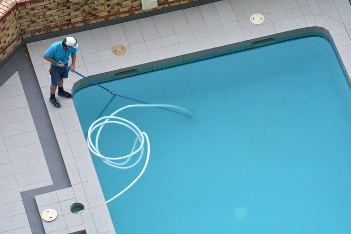 Aerial view of a pool cleaner cleaning a pool. suppliers for hotels