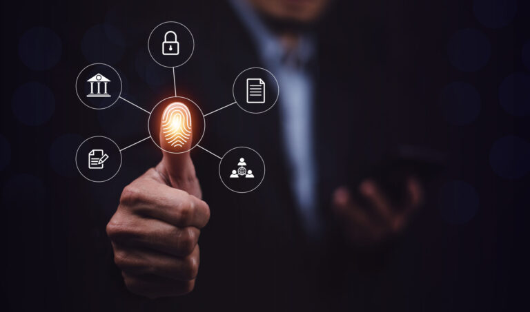 Businessman scans fingerprint to unlock security system Internet storage and financial systems Banking and personal information