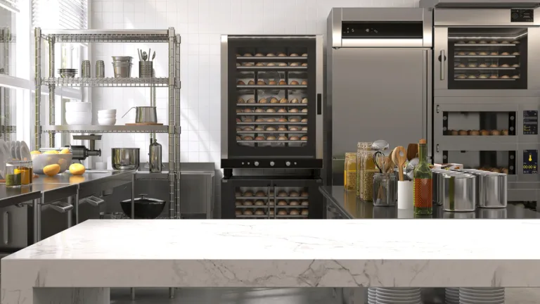 Empty clean white marble top island table in commercial, professional bakery kitchen with stainless steel convection, deck oven, freezer, refrigerator, trolley, cart, bread, bun for industrial food, restaurant, baking business background 3D