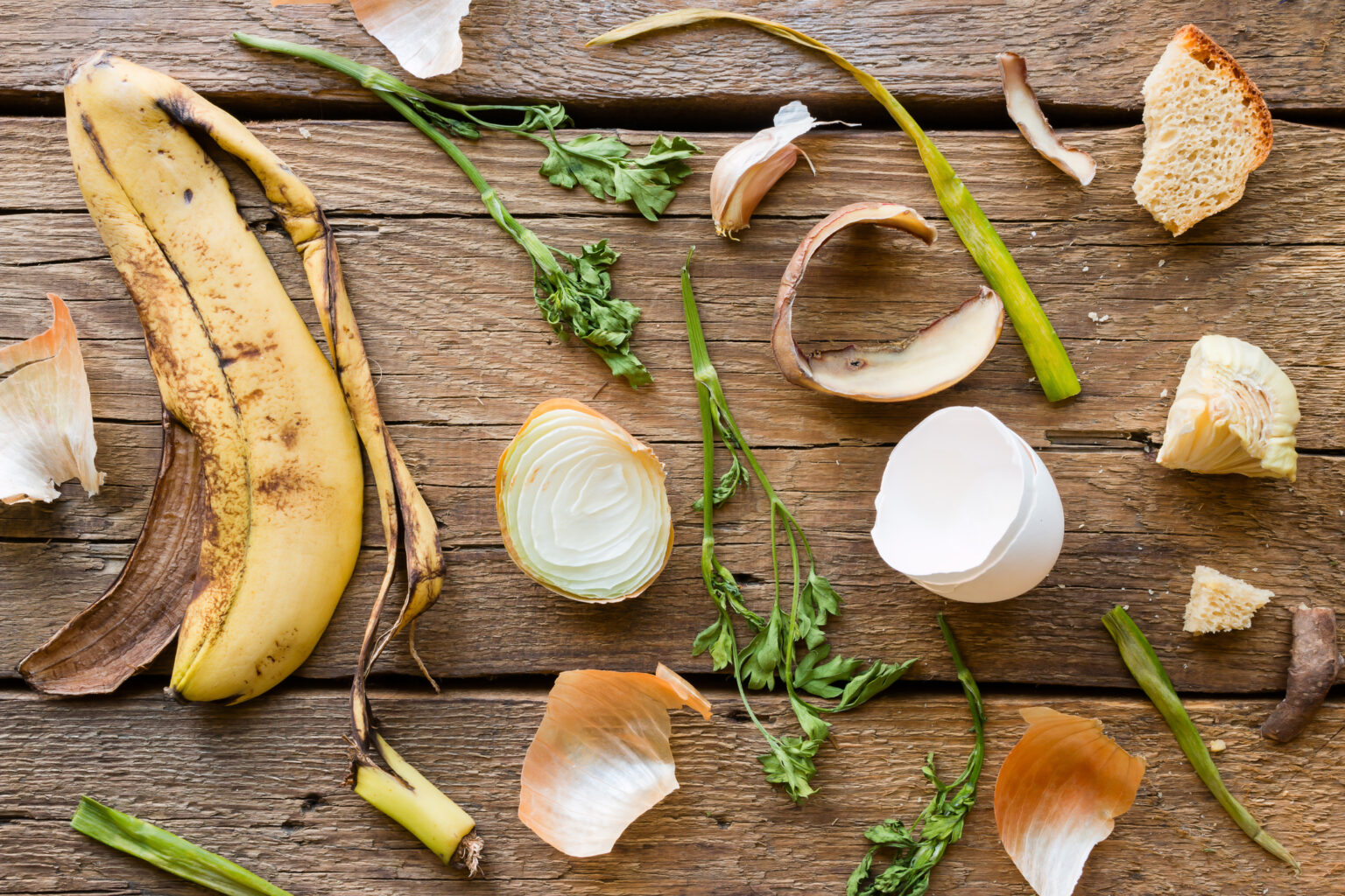 Food waste and leftovers on a wooden background. Reduce Food Waste in the Hospitality Industry